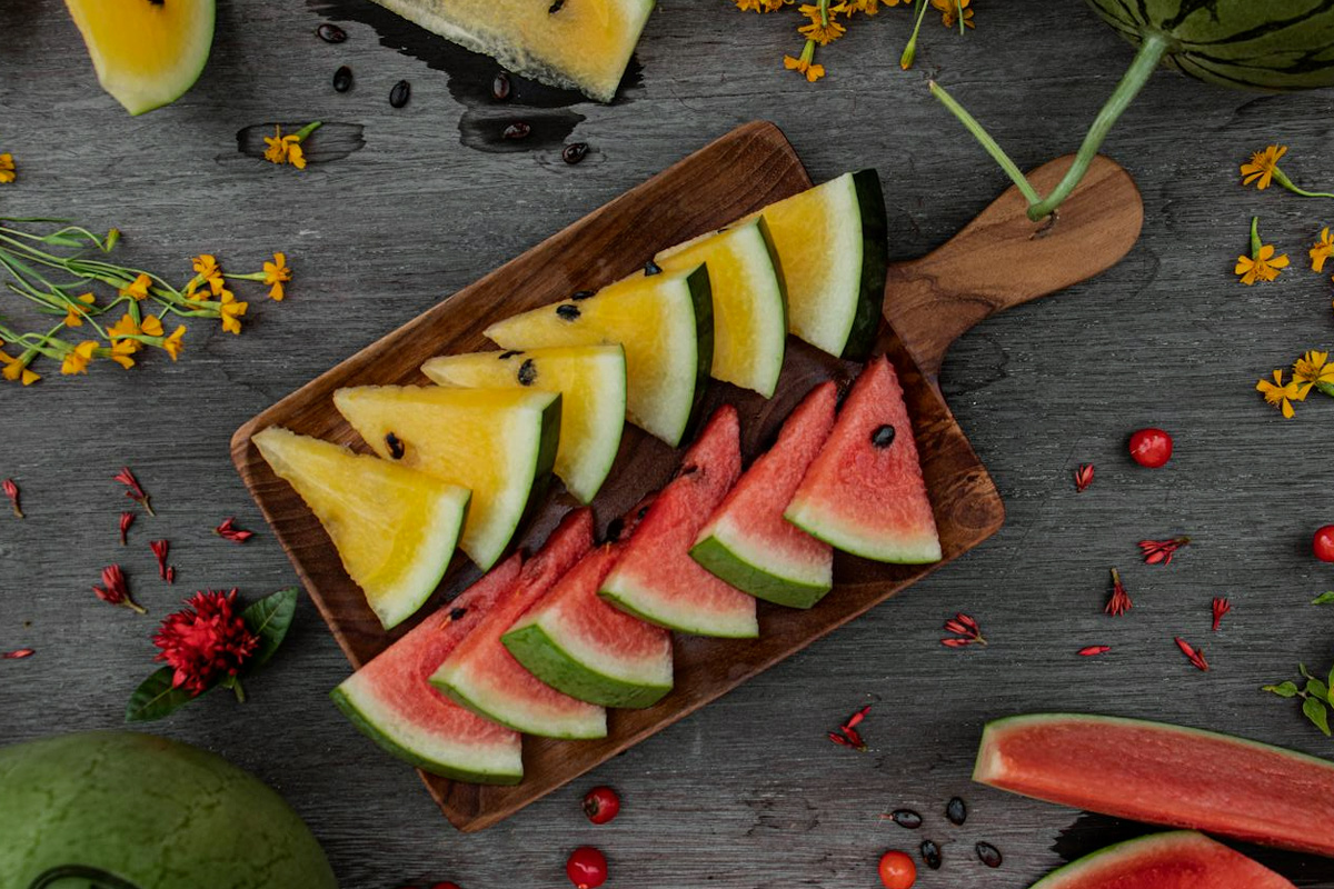Kitchen table, watermelon whole, watermelon slices