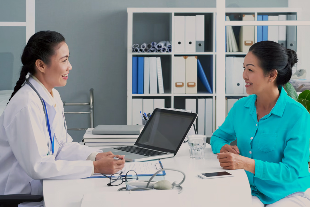 woman talking to a doctor in a clinic