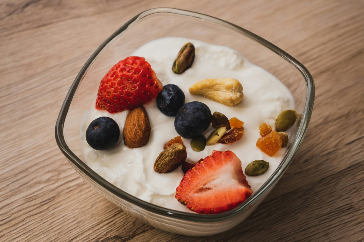 Bowl/cup of yogurt on kitchen table